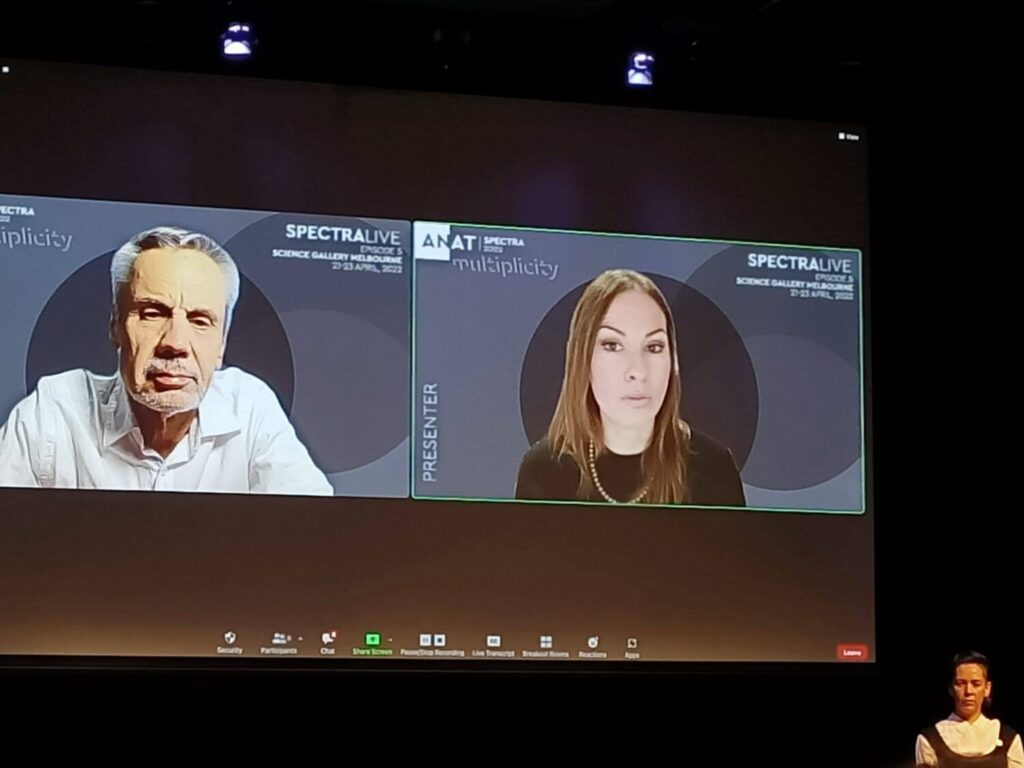Conference presentation with both presenters on big screen on Zoom